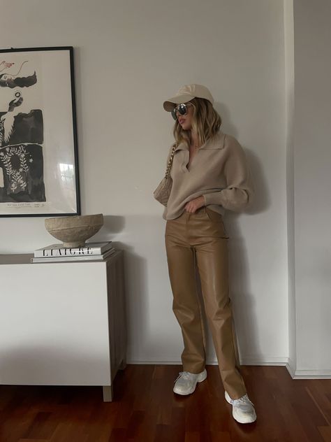 Vegan leather pant. Button and zipper fly. Four pocket construction. Fully lined. Style #: A1196P Material: PU/Cotton Color: Tan Model is wearing a small MODEL STATS: Height: 5'4" / Bust: 32A / Jeans: 24 Also pictured: New England Crop Sweater, Big City Trench Coat Winter Outfit Baddie, Teen Spring Outfits, Winter Outfits Black, Baddie Winter Outfits, Chasing Pavements, Tan Outfit, Girl Baddie, Leather Pants Outfit, Spring Outfits Dresses