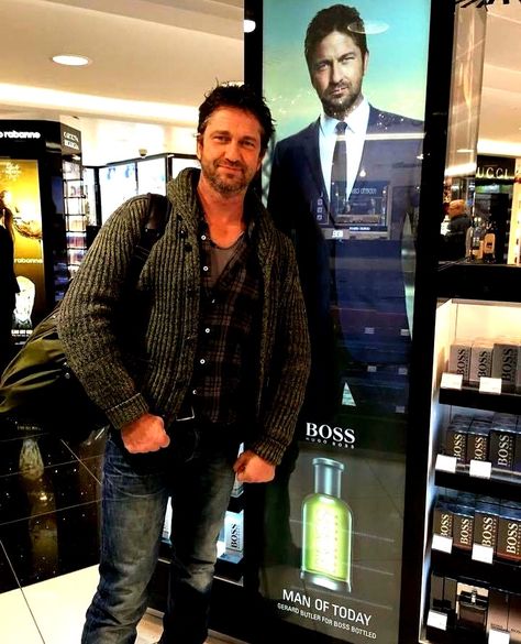 Gerard Butler near his Hugo Boss ad at Glasgow Airport. Actor Gerard Butler, Strong Woman Tattoos, Glasgow Airport, Beautiful Women Quotes, Handsome Men Quotes, Men Quotes Funny, Handsome Style, Handsome Arab Men, Scottish Actors