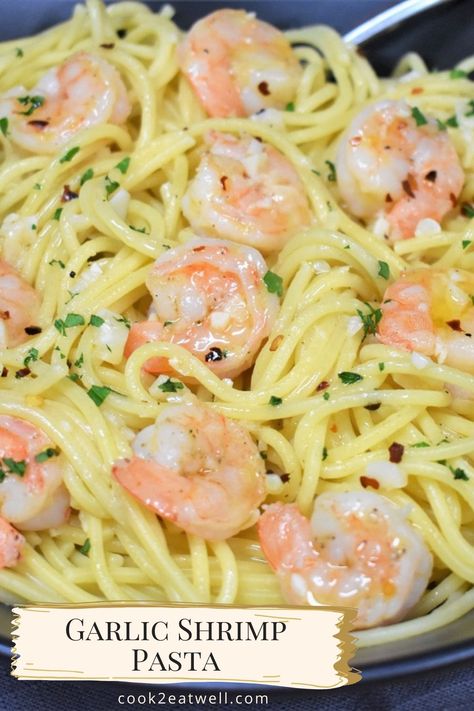 A close up image of the garlic shrimp pasta garnished with chopped parsley. There is a small, gold and off-white banner on the bottom left with the title in black letters. Garlic Oil Pasta, Seafood Pasta White Wine, Shrimp Noodles Recipes, Garlic Shrimp Pasta Recipes, White Wine Pasta Sauce, Garlic Butter Noodles, Shrimp Pasta Recipes Easy, Garlic Butter Shrimp Pasta, Cooked Shrimp Recipes