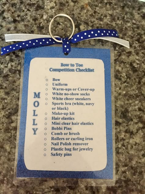 Bag tag/checklists for my daughter's cheer team. Made using paper, 4x6 thermal laminator pouches, key rings and ribbon. Cheer Bag Tag Ideas, Cheer Gift From Coach, Competitive Cheer Gifts For Team, Color Guard Team Bonding, Cheer Comp Checklist, Cheer Competition Checklist, Cheer Bag Checklist, All Star Cheer Gifts Ideas, Dance Team Bonding Ideas