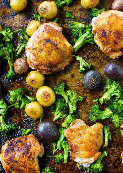 Sheet pan chicken with roasted potatoes and broccoli! Everything cooks together on one baking sheet - so EASY. Use chicken thighs for tender, juicy results every time. Roasted Broccoli And Potatoes, Roasted Potatoes And Broccoli, Potatoes And Broccoli, Broccoli And Potatoes, Sheet Pan Chicken, Sheet Pan Suppers, Roasted Chicken Thighs, Chicken Thigh Recipes Oven, Chicken Thigh Recipes Crockpot