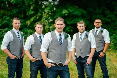 Gray vest, blue jeans groomsmen Gray Vest With Jeans Wedding, Grey Vest And Jeans Groomsmen, Blue Jeans Groomsmen, Dusty Blue Groomsmen Attire Jeans, Gray Vest Groomsmen, Jeans And Vest Wedding Groomsmen, Groomsmen Jeans And Vest, Grey Vest Groomsmen, Jeans Groomsmen