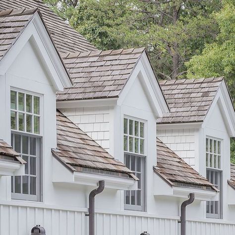 Patrick Ahearn Architect LLC on Instagram: "Centered between operable doors below and gabled dormers above, a trio of artisanal copper lanterns adds an extra layer of character to this suburban Boston carriage house wing. Builder: @sweeneycustomhomes Landscape Architect: @abladeofgrass_inc Photographer: @michaeljleephotography" Dormer Window Above Garage, Garage With Dormers, Dormer Styles, House With Dormers, Karla Sorensen, Gable Dormer, Dormer Ideas, House With Front Porch, Gambrel House