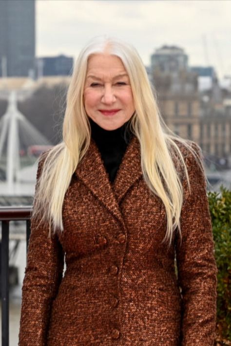 Dame Helen Mirren is not here for the stereotype that older women can’t have long hair. While promoting her role in the upcoming Shazam! Fury of the Gods, the 77-year-old acting legend debuted a new, longer hairdo which she says sarcastically is “radical” for a woman her age. Old Women With Long Hair, Older Women Long Hair, Long Hair Over 60 Aging Gracefully, Hair Style Photos, Hellen Mirren, Helen Mirren Hair, 60 Year Old Hairstyles, Shazam Fury Of The Gods, Long Hair Older Women