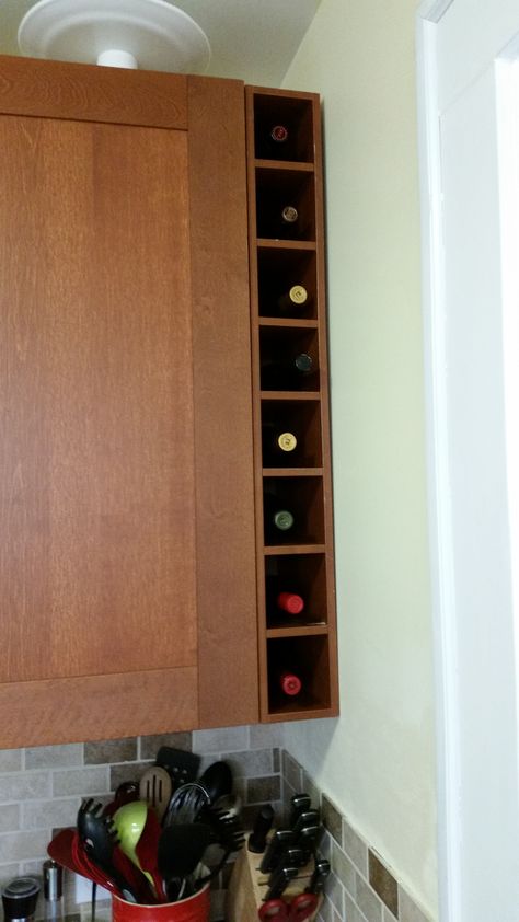 Ikea Hack: Wine Rack from medium brown Ikea cabinet cover boards.  We couldn't find a good wine rack for the 5" gap between the cabinets and the wall, so we built this to match the cabinet designs. Wine Rack Between Cabinets, Kitchen Cabinet Wine Rack Built Ins, Kitchen Wine Storage, Wine Box Shelves, Kitchen Cabinet Wine Rack, Pallet Wine Rack Diy, Renovate Kitchen, Kitchen Cabinets Open, Wood Wine Rack Diy