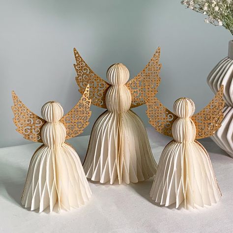 PRICES MAY VARY. CLASSIC ANGELS: Celebrate in style with our modern take on honeycomb party decorations. The white paper angels are trimmed in gold glitter for a festive look. | Set of 3 ( 2 Small, 1 Medium) EASY ASSEMBLY: Thanks to the hidden magnetic closure, the paper angels can be assembled in seconds. | Dimensions: 3.25"D x 5"H and 4"D x 6"H. REUSABLE: Made of sturdy paper, these religious party decorations can be easily folded up and stored for many holiday seasons to come. UNIQUE, VERSATI White And Gold Christmas Table With Angels, Clothespin Angels Ornament Napkin Method, Christian Christmas Table Centerpieces, Toilet Paper Angel, Angel Centerpieces, Christening Table Decorations, Communion Table Decorations, Christening Centerpieces, Winter Table Decorations