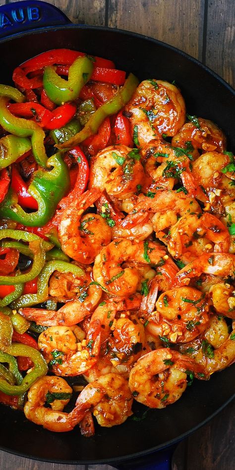 sweet chili shrimp and bell peppers in a cast-iron skillet