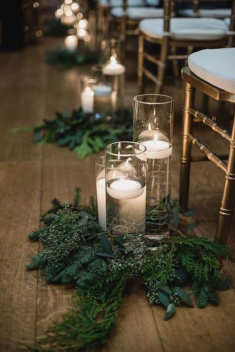 evergreen and greenery arrangements with floating candles in tall vases are nice to accent your wedding aisle Christmas Wedding Themes, Winter Wedding Centerpieces, Christmas Wedding Decorations, Winter Wedding Decorations, December Wedding, Winter Wedding Inspiration, Winter Wonderland Wedding, Wedding Boho, Aisle Decor