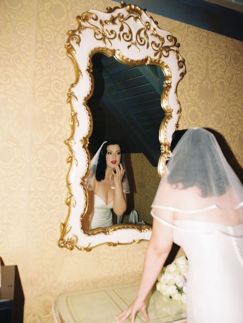 Bride looking at herself in the mirror and touching up her makeup captured on film. Get inspired by more vintage wedding aesthetic, vintage wedding pictures, and classic vintage wedding inspiration. Book Bri as your California wedding photographer or film wedding photographer at briannajulianphoto.com! Vintage Wedding Pictures, Wedding Aesthetic Vintage, Madonna Inn Wedding, Vintage Wedding Aesthetic, Classic Vintage Wedding, Vintage Wedding Inspiration, Madonna Inn, Wedding In California, Red Chandelier