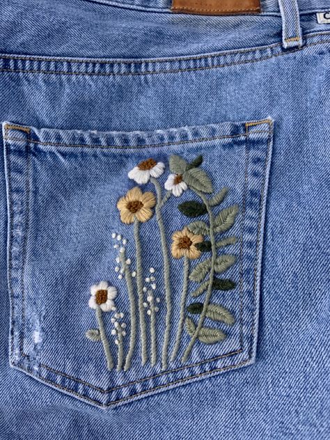 Embelishing a pretty bland jean skirt! #backpocket #jeanembroidery #embroidery #jeans #jeanskirt #pocket #flowerembroidery #floralembroidery #flowers Jean Pocket Embroidery Flowers, Embroidered Jeans Pocket Flowers, Embroidery Skirt Ideas, Jean Skirt Embroidery, Jean Back Pocket Embroidery, Flower Pocket Embroidery, Jeans Back Pocket Embroidery, Embroidery Jean Pocket, Embroidered Jean Pockets