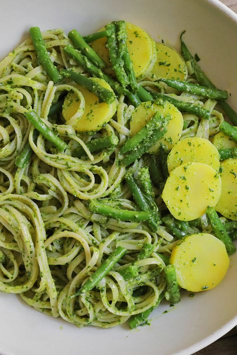 NYT Cooking: The most elegant pasta dish that Italian cooks have ever invented is astonishingly simple to make, especially when pesto is made with a food processor instead of a mortar and pestle. Here, the magical green sauce is tossed with trenette (or any long pasta you can twirl around a fork), tender slices of potato and barely blanched green beans. Summer Pastas, Healthy Risotto, Pasta Green, Green Beans And Mushrooms, Green Beans Potatoes, Pasta With Green Beans, Beans And Potatoes, Blanching Green Beans, Green Beans And Potatoes