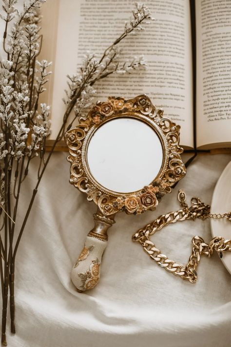 Mirror Lying on Open Book · Free Stock Photo Open Book, Fragrance Oil, Fragrance, Mirror, Glass, Flowers, Floral, Design