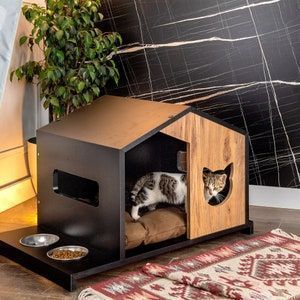 Outdoor Dog House Kennels That Will Make Your Puppy Go Crazy These dog houses are amazing for a few reasons. First, they are all made out of weather-resistant materials, so your dog can enjoy the outdoors no matter what the weather is like. Second, they come in a variety of shapes and sizes, so you can find the perfect dog house for your pooch, no matter how big or small they are. Modern Dog Houses, Chat Diy, Wooden Cat House, Cat Houses Indoor, Wooden Dog House, Outdoor Dog House, Cat Kennel, Cat House Diy, Dog House Diy