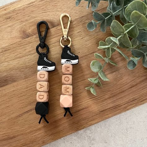 This Keychains item is sold by HelloBelYoun. Ships from Canada. Listed on Aug 7, 2023 Team Building Crafts, Hockey Keychain, Building Crafts, Mom Essentials, Hockey Skates, Black Keychain, Bogg Bag, Wood Personalized, Hockey Mom