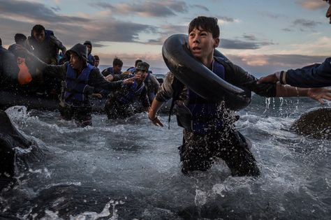 Oct. 1, 2015. After battling rough seas & high winds from Turkey, migrants arrive by rubber raft on a jagged shoreline of the Greek island of Lesbos. | Credit: Tyler Hicks / The New York Times || The New York Times & Thomson Reuters shared the 2016 Pulitzer Prize for breaking news photography for coverage of Europe’s refugee crisis.|| more photos: https://www.facebook.com/nytimes/posts/10150793251599999 Moving Photos, Cannes Lions, Photo Awards, Ansel Adams, Libya, Documentary Photography, Tv Commercials, Alberta Canada, Photojournalism