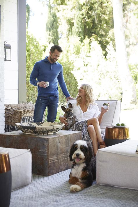 See Inside <i>Always Sunny</i> Stars Kaitlin Olson and Rob McElhenney's Family Compound in L.A. Kaitlin Olson, Gray Brick Wall, Rob Mcelhenney, Mismatched Dining Chairs, Dark Wood Table, Wood Island, It's Always Sunny In Philadelphia, Always Sunny, Sunny In Philadelphia