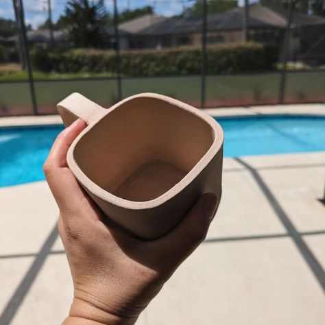 Exploring square shapes... I like a good big mug for coffee and a handle that fits all my fingers. So here is the first mug test. What pattern or design should put on it? Open for suggestion 😊 #square #asymmetrical #mugsmugsmugs #mugclub #potterylife #popofcolour #potterystudio #ceramic #cookware #dinnerware #kitchen #dinner #coffeedrinker #tealovers #coffeelovers #morningperson #drinks #café #caffeine #clayart #claywork #handbuiltpottery #glaze Mugs Pottery, Big Mug, Kitchen Dinner, Ceramic Cookware, Hand Built Pottery, Coffee Drinkers, Pottery Studio, Ceramic Cups, Clay Art