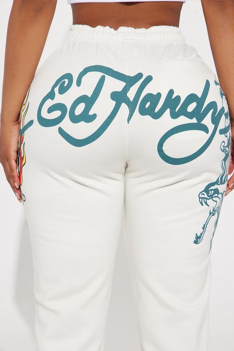 Available In Ivory. Drawstring Wide Leg Pant Front And Back Screen Ed Hardy Graphic Stretch Pair To "Ed Hardy On Fire Zip Front Hoodie" Disclaimer: Due To The Printing Process A Difference In Saturation May Occur. Each Garment Is Unique. 53% Cotton 47% Polyester Imported | Ed Hardy On Fire Wide Leg Pant in Ivory size Small by Fashion Nova Ed Hardy Clothes, Ed Hardy Outfit, Fire Clothes, Cute Online Clothing Stores, Y2k Shirts, White Tracksuit, Denim Skort, Stylish Summer Outfits