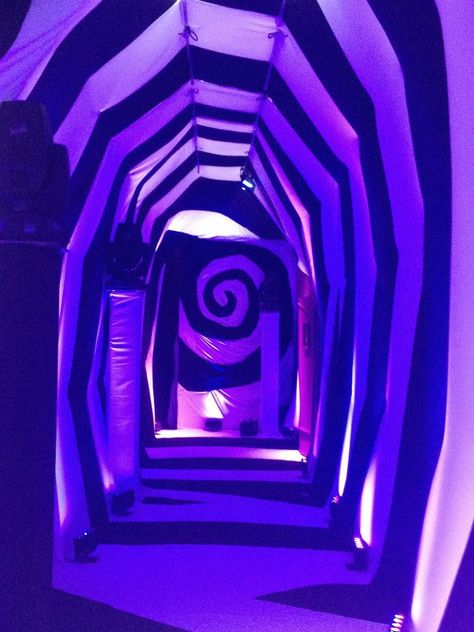 Alice in Wonderland Christmas Event by Creative Draping www.creativedraping.com Creepy Wonderland Aesthetic, Alice In Wonderland Spiral, Purple Circus Aesthetic, Neon Alice In Wonderland, Alice In Wonderland Tunnel, Alice In Wonderland Set Design, Alice In Wonderland Signs, Alice In Wonderland Christmas, Neon Wonderland