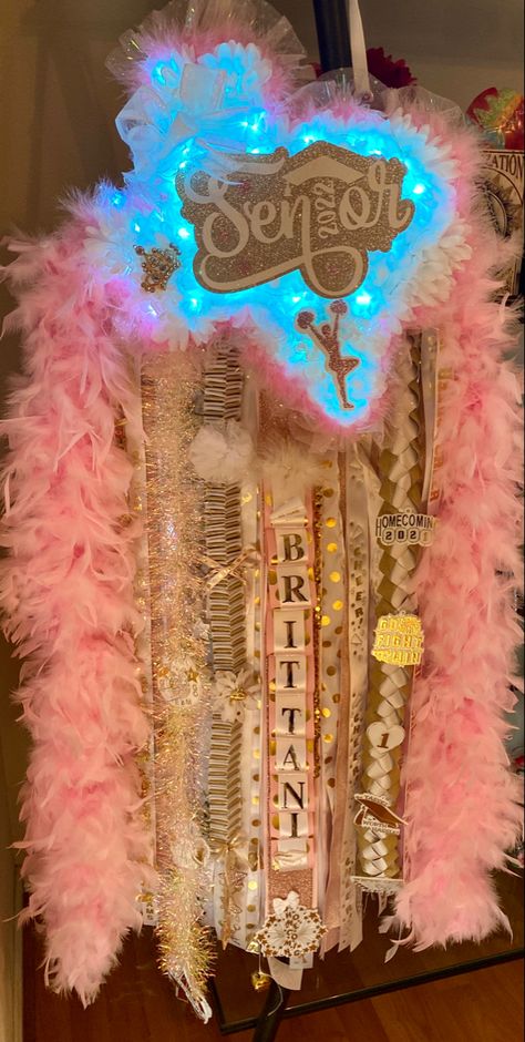 Pink And Blue Mums Homecoming, Hocoming Mum Ideas, Texas Shaped Mums Homecoming Senior, Mum Homecoming Ideas Pink, Pink And Gold Mums Homecoming, Pink Mums Homecoming Senior, Senior Year Homecoming Mum, Senior Mums Homecoming Blue And White, Senior Year Mum