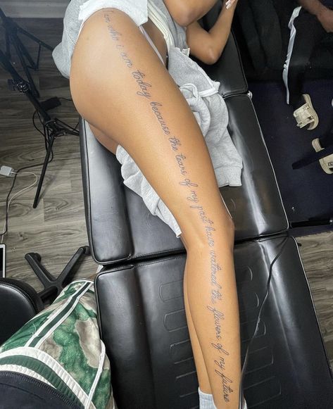 Leg Words Tattoos Women, Word Tattoo Down Side Of Leg, Side Of Leg Tattoos Women Words, Quote Down Leg Tattoo, Leg Word Tattoos For Women, Thigh Tats For Women Words, Words Going Down Side Of Leg Tattoo, Down The Leg Tattoo Quote, Leg Tattoos Women Words