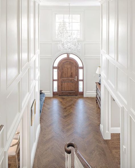 Lavender Hill Interiors on Instagram: “Loving the wall panelling and double height ceiling. The Fox Group - Pinterest  @the_fox_group_…” Double Height Wall Panelling, Armstrong Vinyl Flooring, Fox Group, Arched Front Door, Foyer Staircase, Decorative Molding, Double Staircase, Herringbone Wood Floor, Herringbone Wood