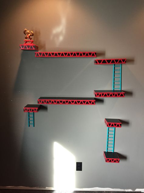 Gamer room: donkey Kong shelves Donkey Kong Shelves, Diy Gamer Room, Gamer Bathroom, Boys Gamer Bedroom Ideas, Boys Gamer Bedroom, Gamer Bedroom Ideas, Nintendo Room, Gamer Room Diy, Tv Shelves