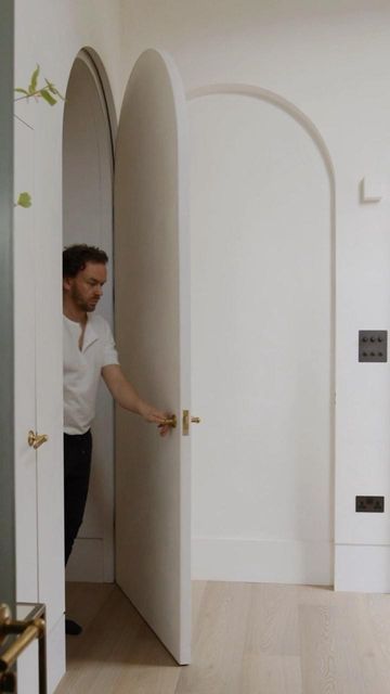 HUTCH on Instagram: "Making an entrance… the secret arched door that disappears in to the wall. Left ‘open’ to bring light through the home, create views and frame the entrance, a clever way to welcome guests in to your house. Captured by @wilsonarcherfilms⁠, custom designed by @hutch.design and made by PM Construction. –– #HUTCH #homesbyHUTCH #luxuryhomes #luxurydesign #naturalmaterials #naturallight #barrelvault #modernliving #architecture #interiors #hiddendoor #secretdoor #arch #slowliving #calm #serene #relaxinghome" Arch Hidden Door, Arch Doors, Secret Door, Arched Doors, Beauty Clinic, Bathroom Door, Hidden Door, Architecture Interiors, Bathroom Doors