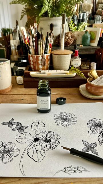 Rae Missigman - Watercolor Botanicals ArtMarks on Instagram: "Drawing simple flowers today with this delicious @birminghampens ink. I have always loved this ink for notes and letters but it performed wonderfully on watercolor paper today. This zucchini color is a deep greenish black. *I’m not a paid sponsor I just really like their products and thought I’d share my findings with my fellow art peeps.🥰🖋️ #penandinkdrawing #inkdrawings #artsketches #morningart #artstudiolife #raemissigman #creativepractice #birminghampencompany #vintageartsupplies #mixedmediadrawing #paperandink #floraldrawing #flowersketch #botanicaldrawings #vintagestyleart" Rae Missigman, Vintage Style Art, Flower Sketches, Floral Drawing, Simple Flowers, Botanical Drawings, Ink Pen Drawings, Paper And Ink, Art Studios