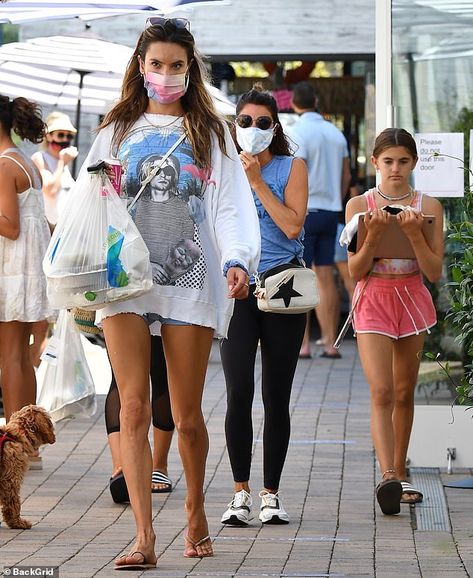 Legs for days: Alessandra's top swallowed up her jean shorts and highlighted her long, tan... Kurt Cobain Shirt, Tanned Legs, Tan Legs, Wear A Mask, Style Finder, Alessandra Ambrosio, Edgy Look, Kurt Cobain, A Mask