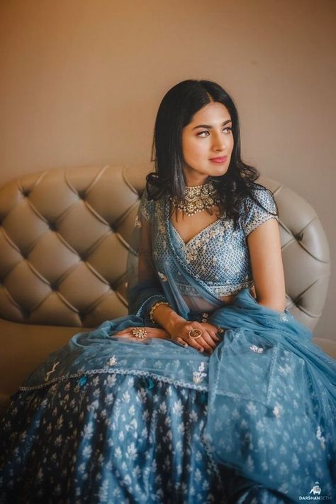 Photo of engagement lehenga in blue with light jewellery Light Blue Lehenga, Monsoon Wedding, Bun With Curls, Engagement Lehenga, Lehenga Jewellery, Light Jewelry, Blue Lehenga, Bride Sister, Pink Lehenga