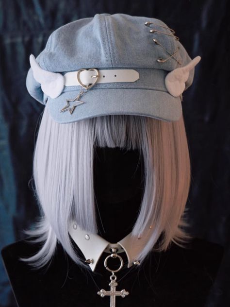 Elevate your accessory game with our handmade heart buckle and wings light blue denim hat. This adorable hat features a unique handmade heart buckle and wings, adding a touch of whimsy to your look. The light blue denim gives it a fresh and casual vibe, perfect for everyday wear. Complete with a star charm and pins for added flair, this hat is a statement piece that will surely turn heads.   Please note that this product includes only the hat. Blue Headpiece, Cool Hair Designs, Hair Inspiration Long, Gothic Accessories, Kawaii Fashion Outfits, Denim Hat, Handmade Heart, Historical Dresses, Light Blue Denim