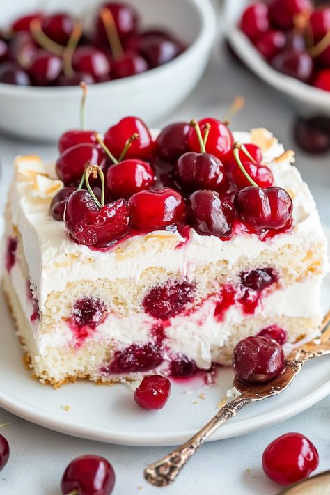 Heaven on Earth Cake is a delightfully simple layered dessert crafted with ready-made ingredients. It features layers of fluffy angel food cake, sweet cherry pie filling, smooth vanilla pudding, and airy whipped topping, all finished with a sprinkle of sliced almonds. Utilizing canned cherry pie filling offers a tasty shortcut for this dessert. Explore other Cherry Surprise Dessert, Layered Angel Food Cake, Strawberry Angel Food Cake Dessert, Canned Cherry Pie Filling, Cherry Almond Cake, Canned Cherry Pie, Heaven On Earth Cake, Berry Pie Filling, Cherry And Almond Cake