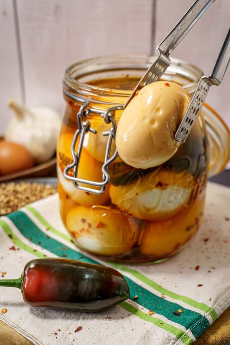 Unleash bold flavors with my Spicy Pickled Eggs recipe! Infused with jalapeños and dill, these eggs are not just a treat but a conversation starter. Perfect for your next party or as a zesty snack, these pickled eggs pack a punch and are guaranteed to impress. Follow this easy recipe to create a batch of flavor-packed eggs that are sure to spice up any meal or snack time. Let’s get pickling and add some spice to your pickled treats! Hot Pickled Eggs Recipe, Asian Pickled Eggs Recipe, Sweet Pickled Eggs, Pickled Hot Dogs, Jalapeño Pickled Eggs, Pickled Egg Recipes Spicy, Mustard Pickled Eggs Recipe, Sweet And Spicy Pickled Eggs, Spicy Pickled Eggs Recipe