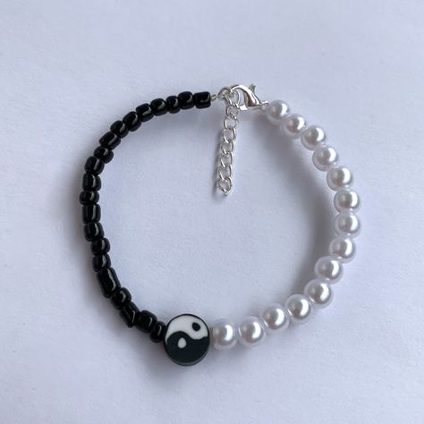 This yin yang bracelet is half pearls and half glass black beads. There is also a yin yang bead in the middle. You can choose from black beads or metallic black beads This bracelet has an extension chain so it’s adjustable and can be worn by multiple sizes Total Length: 20 cm Diy Beaded Jewelry, Yin Yang Bracelet, Cute Friendship Bracelets, Homemade Bracelets, Black Beaded Bracelets, Diy Bracelets Easy, Diy Bracelet Designs, Beads Jewellery, Beads Bracelet Design