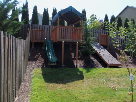 Backyard hillside rock wall, slide and play area, sloped yard Playground Landscaping, Sloped Backyard Landscaping, Play Area Backyard, Sloped Yard, Play Garden, Sloped Backyard, Landscaping Retaining Walls, Hillside Landscaping, Sloped Garden