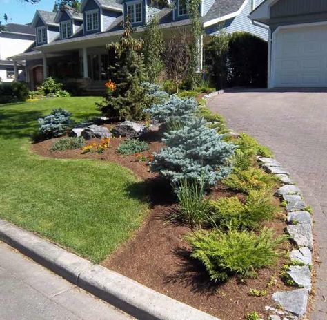 landscaping ideas with rocks corner fence | Stone border along driveway surrounding flower bed. Rock Flower Beds, Driveway Edging, Diy Driveway, Mulch Landscaping, Driveway Ideas, Driveway Landscaping, Front Yard Landscape, Front Yard Ideas, Best Landscape