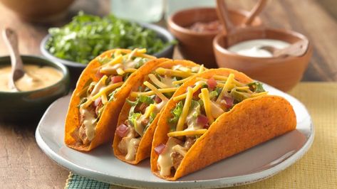 These tacos are sure to be a hit with your family with a cheesy nacho shell and topped with two additional cheeses. Even better, they come together in only 10 minutes! Del Taco, Easy Taco, Cheesy Chicken, Taco Recipes, Taco Bell, Mexican Dishes, Copycat Recipes, I Love Food, Quick Meals