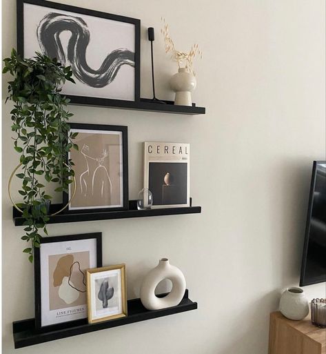 Black Floating Shelves Hallway, Black And Beige Shelf Decor, Behind The Desk Decor, Black Wall Shelves Living Room, Floating Black Shelves Living Room, Photo Wall Collage With Shelves, Black Floating Shelf Decor, Black Floating Shelves Bedroom, Black And White Shelf Decor