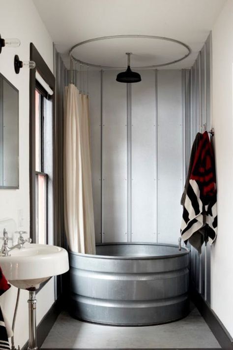 Like Stock Tank Pools? Then You’re Gonna Love Stock Tank Bathtubs  #purewow #home #bathroom #renovation Stock Tank Bathtub, Rustic Shower Ideas, Rustic Bathtubs, Primitive Bathrooms, Galvanized Tub, Best Bathtubs, Rustic Shower, Cabin Bathrooms, Rustic Bathroom Designs