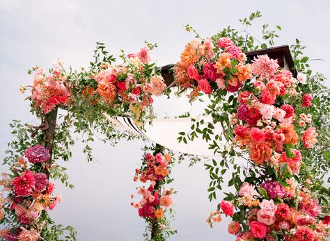 Colorful Wedding Chuppah, Colorful Floral Chuppah, Chuppah Flowers Wedding, Colorful Indoor Wedding, Pink And Orange Wedding Arch, Summer Chuppah, Colorful Chuppah, Colorful Wedding Arch, Chuppah Inspiration