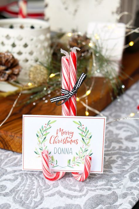 Dress up your table this holiday season with these free printable Christmas place cards and DIY candy cane place card stand.