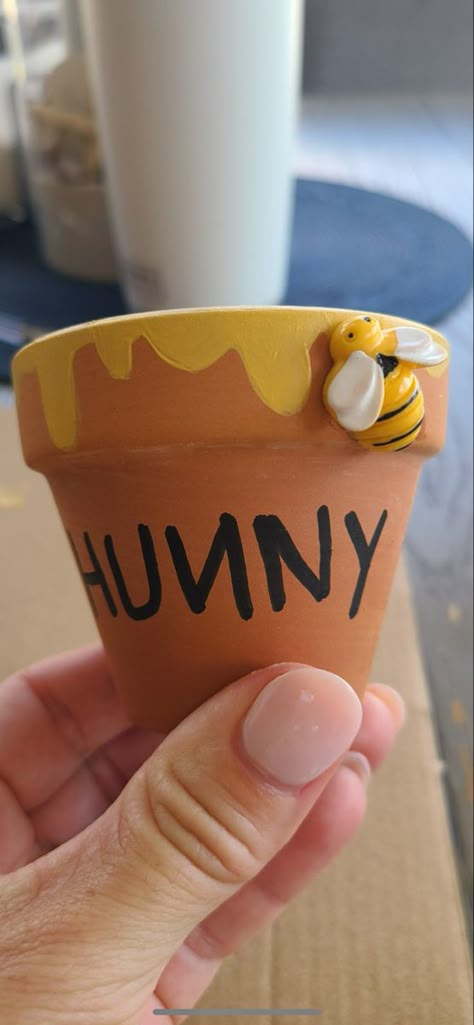 Winnie The Pooh Hunny Pot Centerpieces, Pooh Hunny Pot Diy, Hunny Pots Winnie The Pooh, Winnie The Pooh Pots, Honey Pot Craft, Honey Pot Cupcakes, Diy Hunny Pot, Dollar Tree Winnie The Pooh Diy, Diy Winnie The Pooh Centerpieces