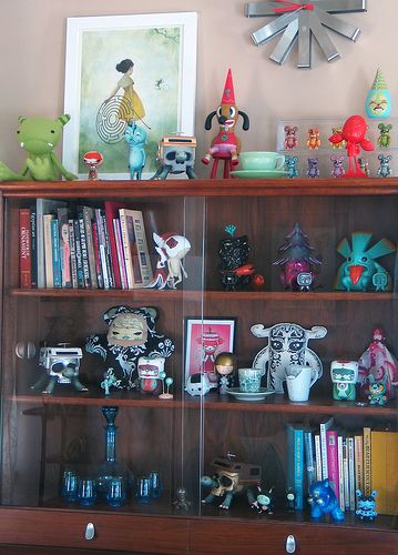 Display cabinet with some of my collection in my home. #saraharvey Vinyl Toy Display, Urban Utopia, Jean Print, Jeremy Fish, Shelf Arrangement, Shelf Decor Living Room, Inside A House, Ink Magazine, Otaku Room