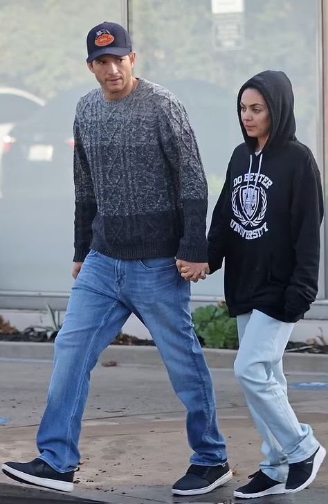 Ashton Kutcher and wife Mila Kunis Ashton Mila, Mila Kunis And Ashton Kutcher, Bear Grylls, Ashton Kutcher, Walk Together, Black Hood, Hold Hands, Best University, Black And White Sneakers