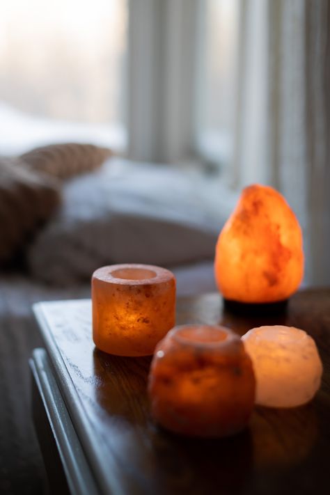 Himalayan Salt Lamps and candle holders on a table top. Warm, ambient light creates a warm glow. Eco Candles, Home Smell, Salt Lamps, Himalayan Salt Lamp, Calming Atmosphere, Post Partum, Improve Mood, Himalayan Salt, Candle Companies