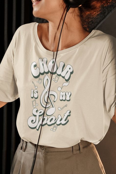 🎵🎶 Elevate your vocal game with our 'Choir Is My Sport' t-shirt! It's the perfect gift for choir enthusiasts and music lovers. 🎁👕 Whether it's for a choir member, a friend, or yourself, this tee celebrates the passion for harmonizing. Gift it to help them showcase their love for music and style with every note! #GiftIdeas #ChoirEnthusiasts #MusicLovers Choir Tshirts Design, Choir Shirt Ideas, School Spirit Wear Designs, Spirit Wear Designs, Choir Shirts, Company Ideas, School Spirit Wear, Tshirts Design, Love For Music