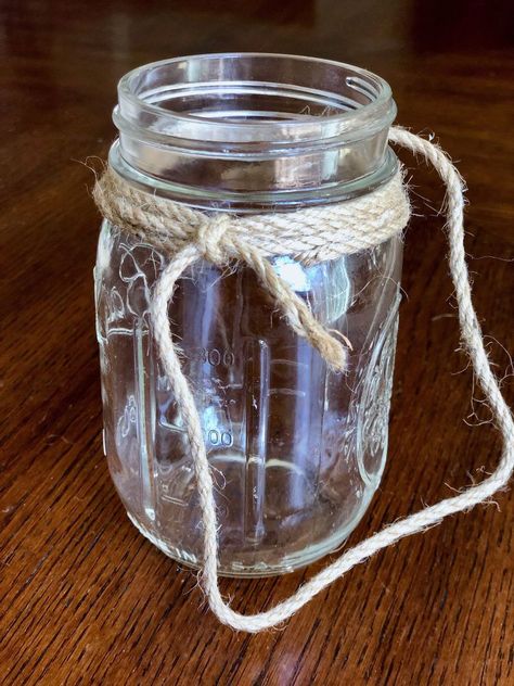 Add a farmhouse touch to your home with this rustic Mason jar wall decor.    For more fun DIY ideas, check out my blog HERE.    I actually stained my wood with one coat of an ebony color but if you feel more comfortable working with black acrylic paint or black spray paint, it works just as well.    Once the stain was dry, I brushed on two coats of white chalk paint. A disposable foam brush will prevent any brush marks when working with chalk style paint, and it’s easy clean up. Next… Mason Jar Twine, Mason Jar Hanger, Mason Jar Wall Decor, Rustic Wall Decor Diy, Diy Mason Jar, Hanging Mason Jars, Paint White, Rustic Mason Jars, Black Spray Paint