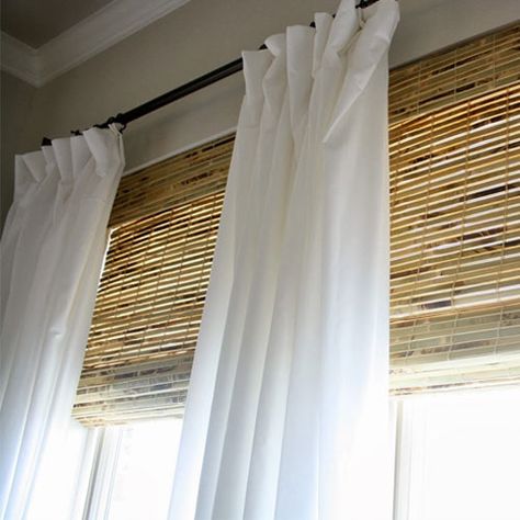 Balance out the dynamic texture of woven wood shades by layering simple drapery panels on top. Layer Window Treatments, Window Covering Ideas, Faux Blinds, Layered Window Treatments, Window Treatments Blinds, Cottage Dining Rooms, Glamorous Decor, Home Windows, Woven Wood Shades