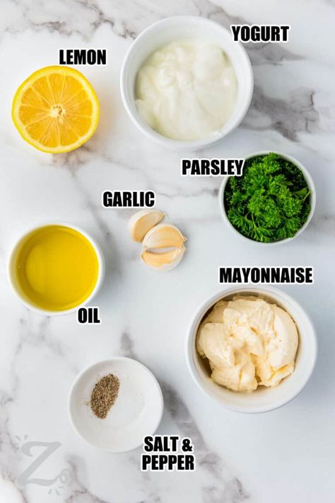 For a versatile go-to dip or dressing that tastes great on salads, bread, and vegetables, try this easy garlic sauce recipe. This Papa Johns copycat is made in just five minutes by blending fresh garlic cloves with mayonnaise, yogurt, lemon juice, olive oil, and herbs. Use it as a dip for pizza crust, but don’t stop there! Rich and tangy garlic sauce tastes amazing on vegetables and sandwiches or as a dip for chips or pretzels. #garlicsauce #garlicsaucerecipe #ourzestylife #garlicsauceforpizza Olive Oil Garlic Sauce, Garlic Sauce For Pizza, Slow Cooker Pasta Recipes, Easy Truffles, Garlic Sauce Recipe, Aioli Recipe, Garlic Dip, Salad Dressing Recipes Homemade, Homemade Ranch Dressing